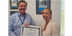 Cindy Axisa, PCOA presenting Trevor with the award at the Centium offices.