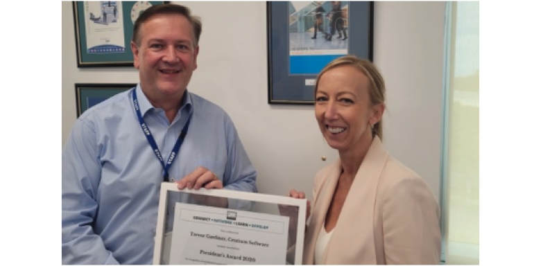 Cindy Axisa, PCOA presenting Trevor with the award at the Centium offices.